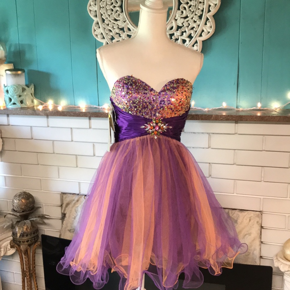 Exquisite Riva design cocktail dress. Gorgeous colors of purple & orange.